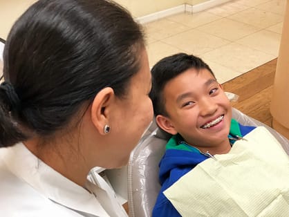 General Dentistry Services | Trusted Dental Care | We Care Dental Dr. Chona and a patient smiling after a dental cleaning, reflecting trust and care at We Care Dental.