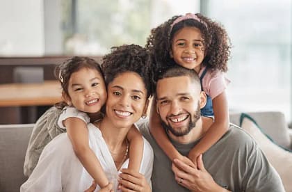 Welcoming Dental Care for Families | We Care Dental Family & Cosmetic Dentistry | Dublin, CA Smiling family receiving gentle dental care at We Care Dental in Dublin, CA: modern family dentistry with Dr. Chona Lardizabal.